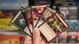 Jason holding a fan of Cards from MTG