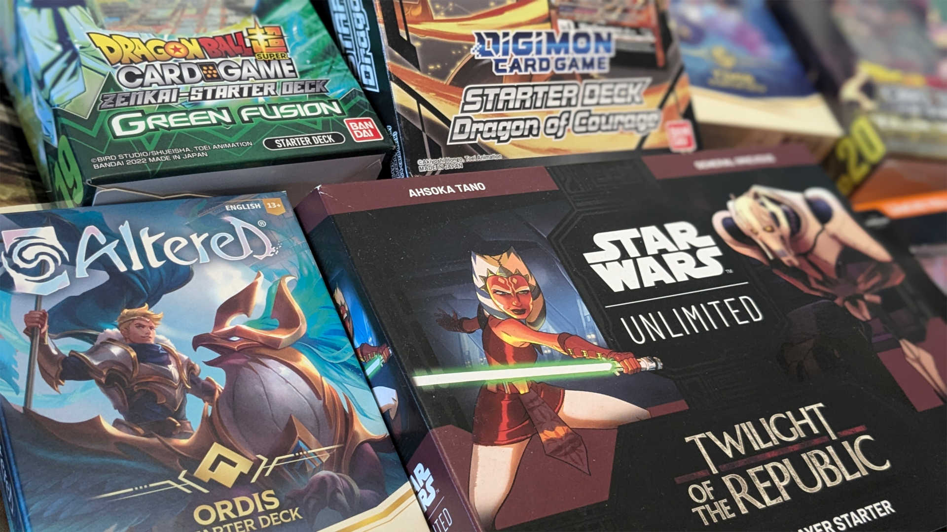 A selection of Starter decks for Digimon, Dragon Ball, Star Wars and Altered