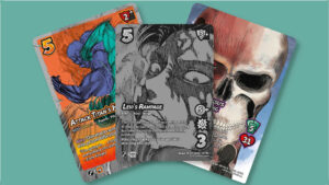 Three cards fanned out from Attack on Titan UniVersus set, origins of Power