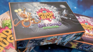 Mindbug Beyond Evolution box, on top of Mindbug and Mindbug: Beyond Eternity