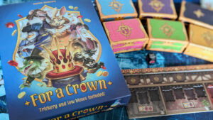 The box and contents of the game, For a Crown
