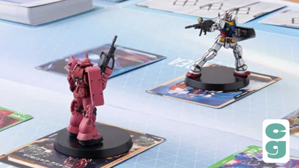 Two Gundam miniatures from the Gundam Card Game