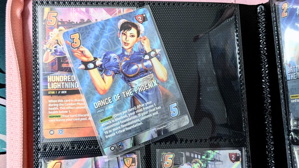Vault X Exo-Tec Zip Binder 4 Pocket Pink - sliding a card in