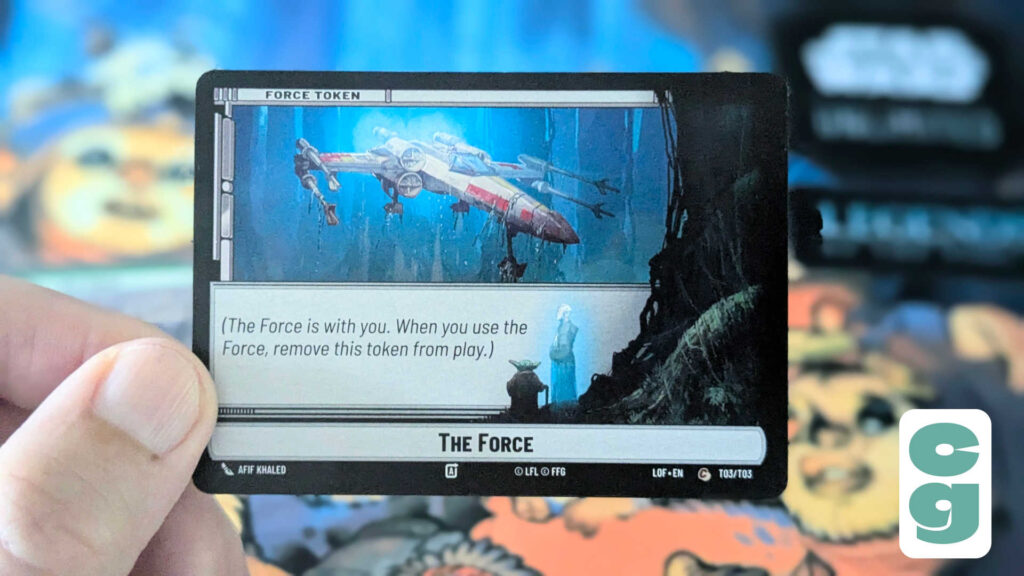 The Force token in hand, from Star Wars Unlimited