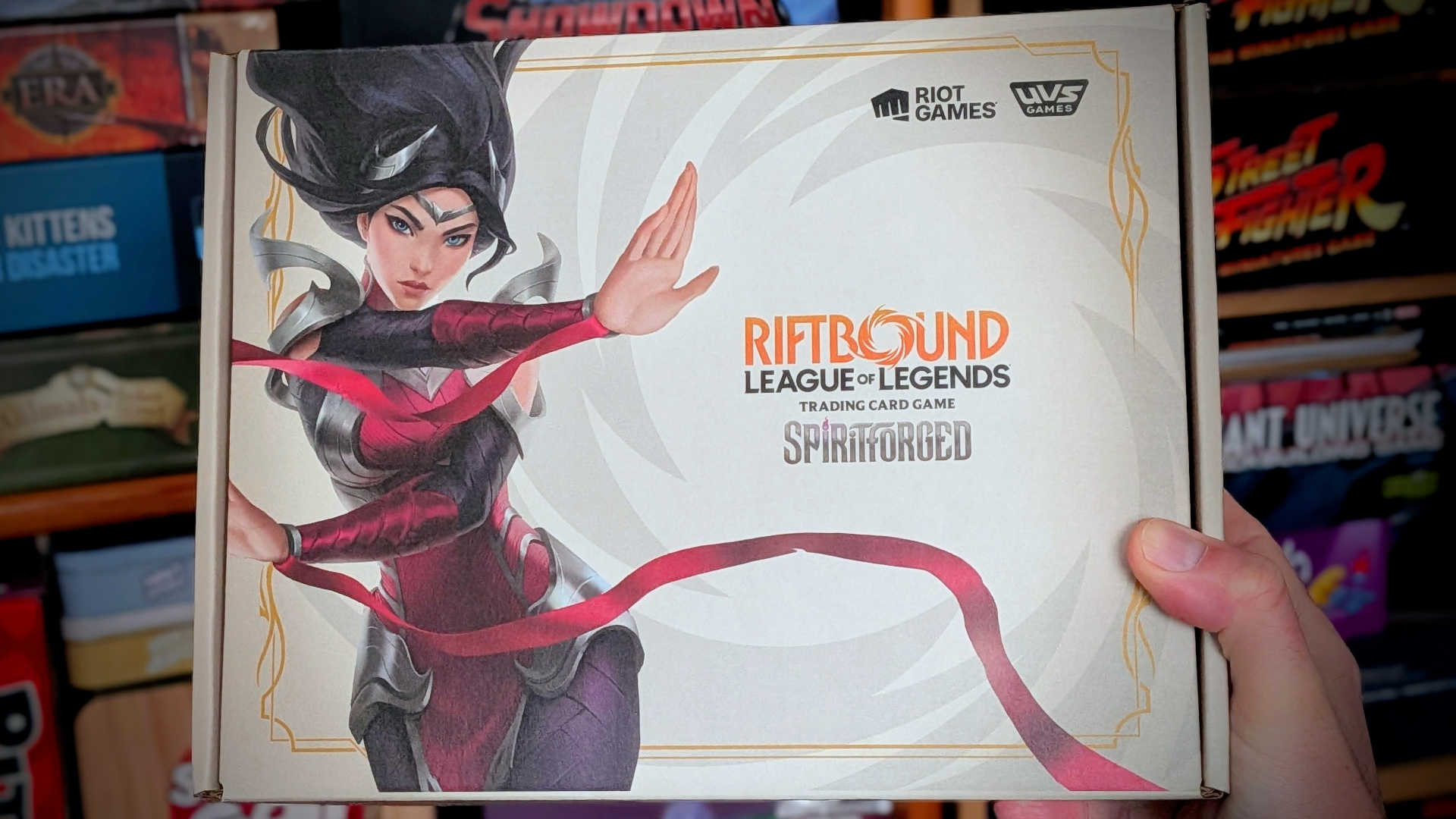 Riftbound Spiritforged Box Set Being Held