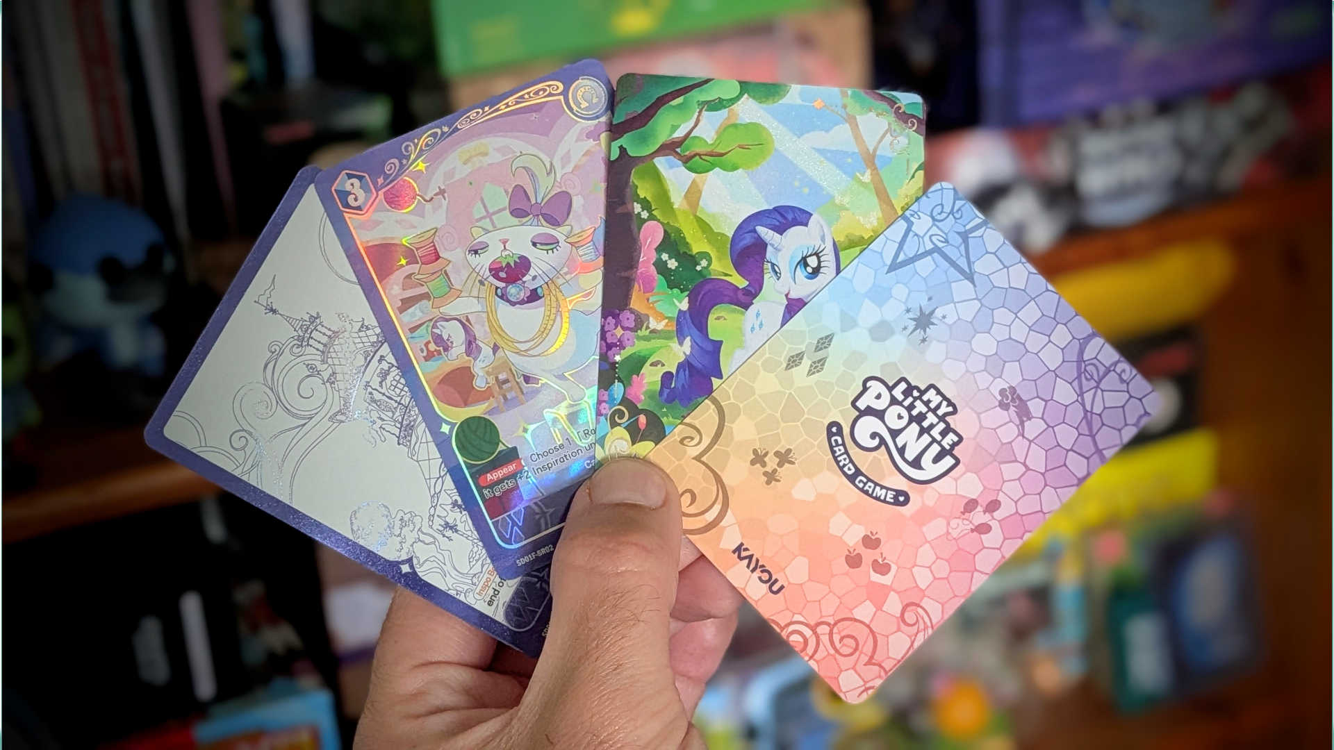 My Little Pony cards in hand